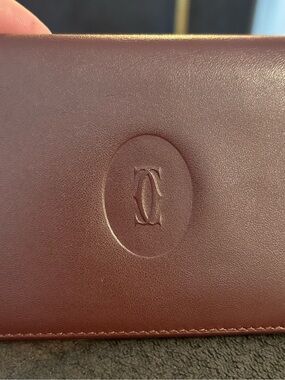 Cartier Gold Logo on Burgundy Leather